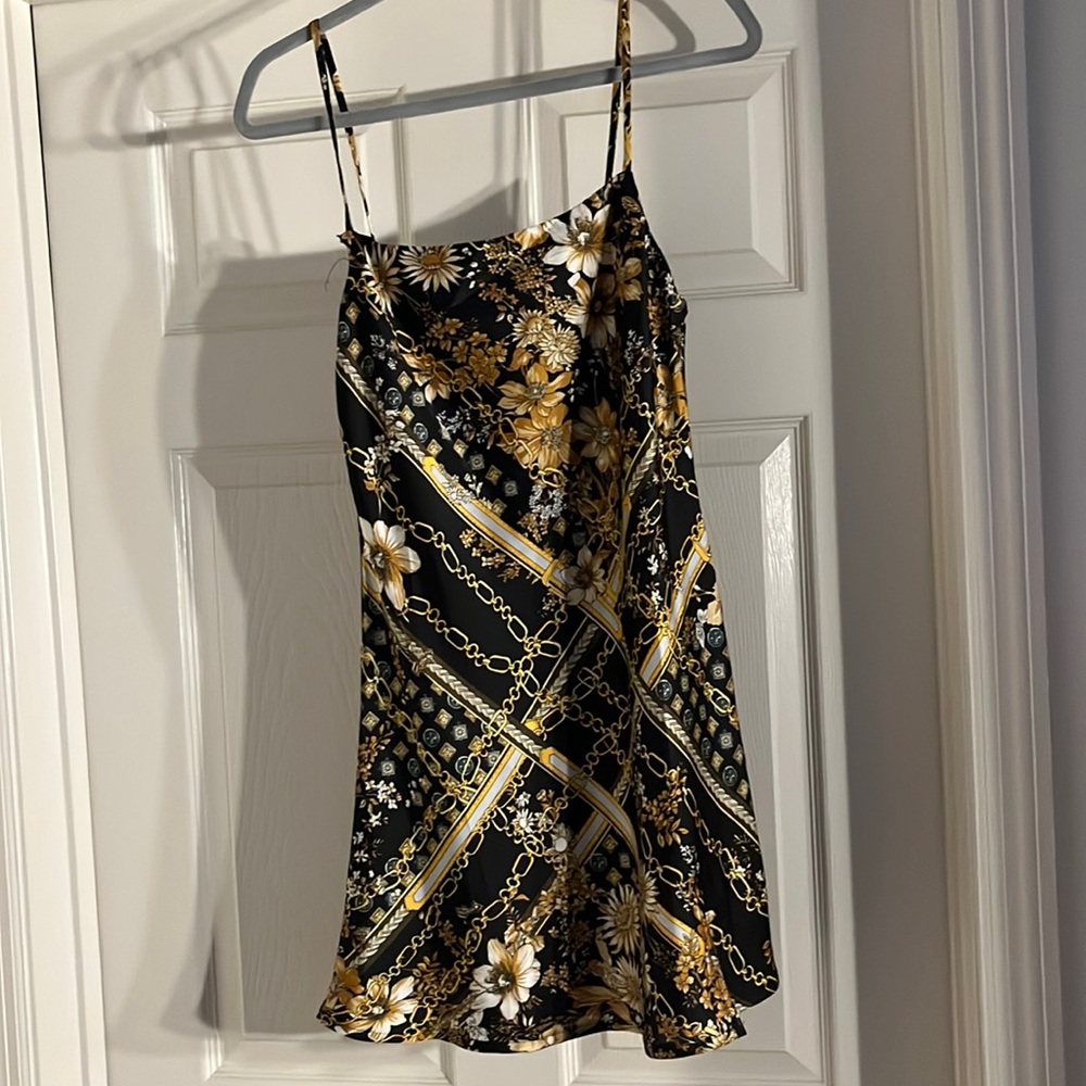 Mini gold and black slit dress
